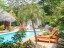 área de relax con piscina - relaxing area around the pool
